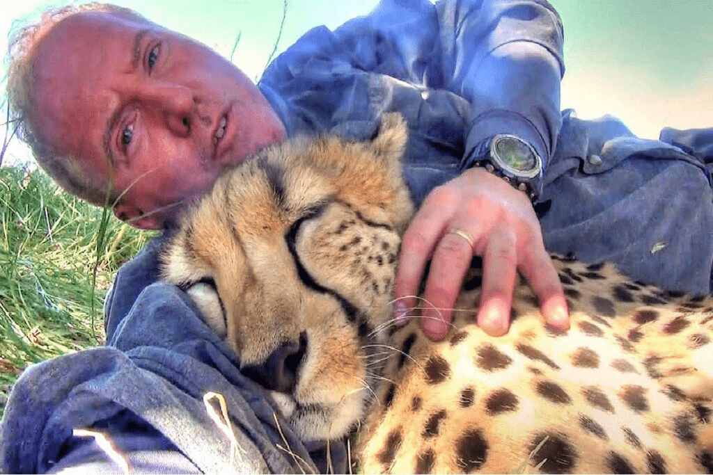 Wildlife Photographer wakes up to cheetah sleeping with him